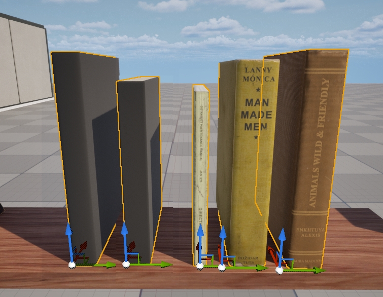 A group of 5 books, 2 with grey covers and 3 with yellowish/orange covers. Each book has a transform gizmo showing their pivot point. They are set on a wooden shelf. There is a checkered floor in the background and clouds in the distance.